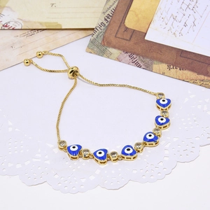 Adjustable gold heart evil eye bracelet with blue zircon and sliding clasp design