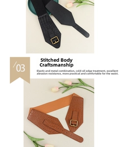 Detail of crocodile embossed leather belts with elastic webbing and metal buckle