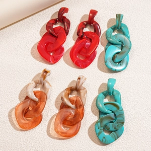 Exaggerated acrylic chain earrings in red orange and turquoise geometric link design