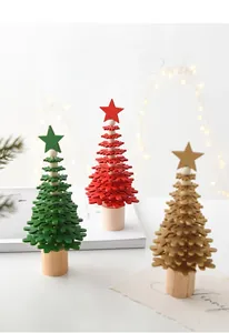 Three-piece mini wooden Christmas tree set with snowflake design in red, green and gold