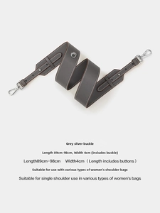 Detail of adjustable grey PU shoulder strap for handbags with silver metal lobster clasps