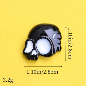 Detailed view of black resin skull charm showing size 1.10 inches for Halloween DIY crafts