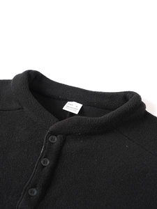 Detail of the stand collar and soft fleece texture on this black men's slim hoodie