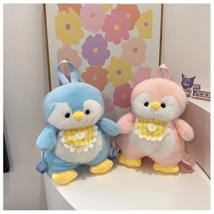 Detail of pink and blue plush penguin backpacks with daisy bibs and adjustable straps