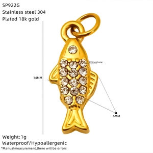 Macro view of 18k gold plated stainless steel fish pendant with clear zircons