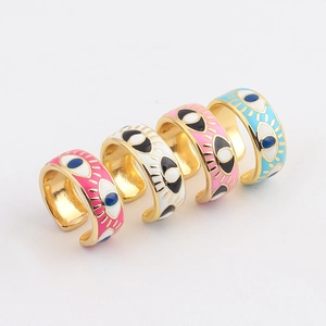 Set of five colorful gold plated evil eye rings with vibrant enamel drip oil finishes