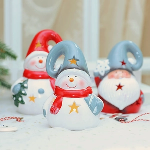 Hollow ceramic Christmas snowman and Santa Claus glowing tabletop ornaments in red and white
