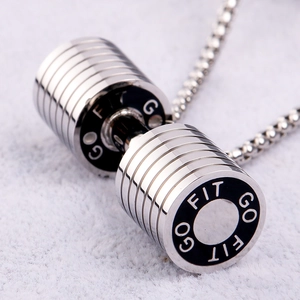 Macro shot of stainless steel dumbbell pendant with GO FIT engraving on box chain