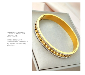 Close-up of 18K rose gold braided bracelet with sparkling micro-pave crystals decoration