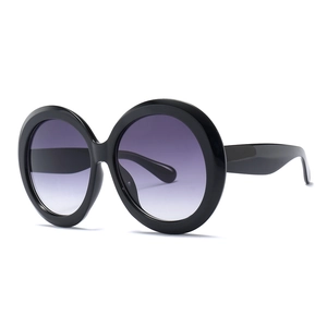 Oversized retro round frame sunglasses for women with thick black frames and gradient lenses