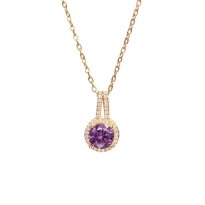 Elegant gold necklace with a round purple zircon pendant and halo of clear crystals