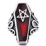 Detailed macro shot of a gothic coffin-shaped ring with a red pentagram star design
