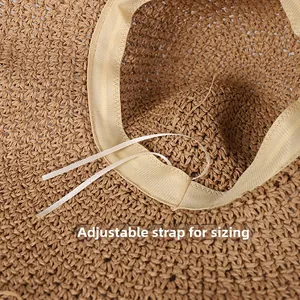 Detail view of the interior sweatband with adjustable string on handmade straw sun hat