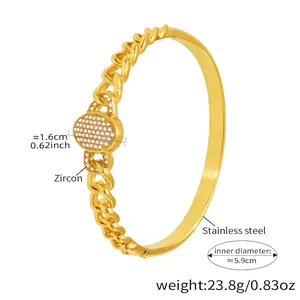 Detail of gold-plated stainless steel NK chain bracelet with zircon pavé centerpiece