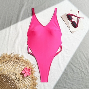 Macro shot of rose pink one-piece swimsuit featuring side cut-outs and metal buckles