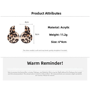 Macro shot of large leopard print acrylic circle earrings showing 6cm by 4cm dimensions