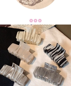 French ink pattern acetate claw clips in marble and striped textures on beige fabric