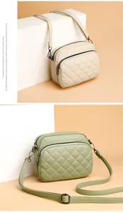 Detailed view of quilted faux leather texture and multi-zipper layers on crossbody bags