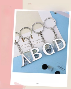Polished silver alphabet keychains A to D with sturdy metal rings and short chains