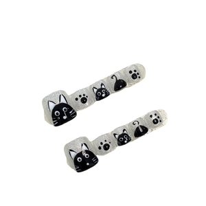Handmade silver glitter press-on toenails with cute black cat and paw print designs