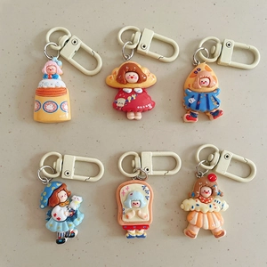 Set of six cute cartoon girl resin keychains with colorful outfits and D-ring clasps