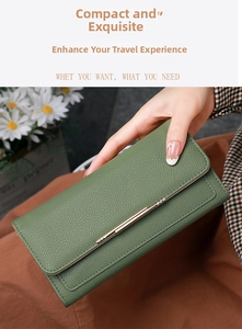 Detail of green litchi grain texture wallet with elegant gold metal bar accent