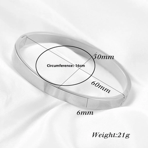Detail of 6mm silver stainless steel bangle with 16cm circumference and snap closure