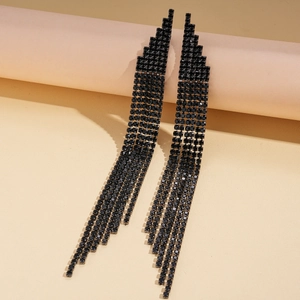 Detailed close-up of long black rhinestone tassel earrings with a geometric tiered design