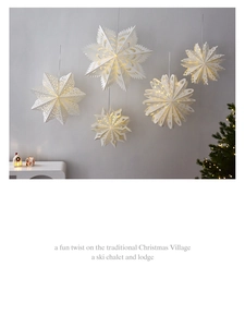 Set of five white paper star lanterns with warm LED lights for Nordic Christmas decor