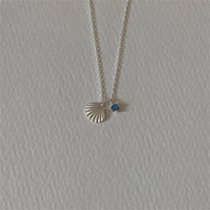 Minimalist 925 sterling silver shell pendant necklace with a round blue gemstone