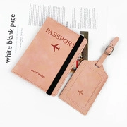 Detail view of light pink PU leather passport holder and luggage tag travel set with elastic strap