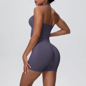 Detail view of seamless knit yoga set showing backless halter top and high-waisted shorts