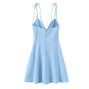 Back view of light blue floral poplin mini dress with thin straps and hidden zipper