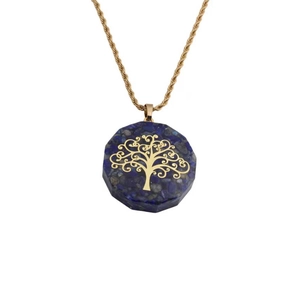 Detailed view of Lapis Lazuli pendant featuring gold Tree of Life and faceted edges