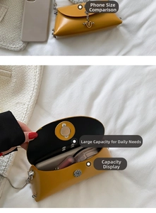 Internal view of small yellow leather crossbody bag showing capacity for phone and cosmetics