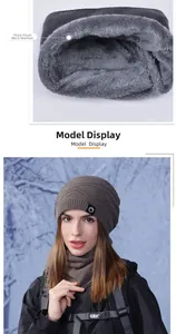 Detail of the thick grey plush lining and knit texture of the winter beanie and scarf set