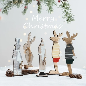 5-piece wooden Christmas figurine set with reindeer and snowmen on snowy background