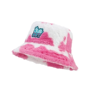 Pink and white cow print plush bucket hat with Chill OUT embroidery patch and soft fur