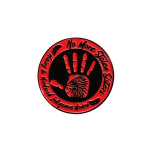 Red and black enamel pin featuring No More Stolen Sisters design and handprint logo