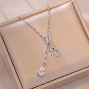 Elegant silver double gourd pendant necklace with sparkling zircon pavé in a jewelry box