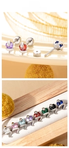 Detailed view of colorful heart zircon snake earrings with screw back butterfly design