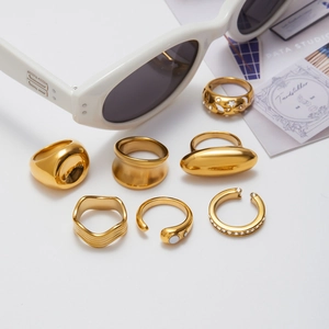 Golden natural stone ring and earring set in various minimalist and textured designs
