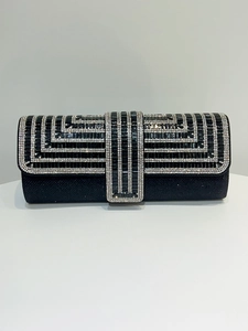 Macro detail of rectangle black evening bag with silver rhinestone geometric patterns