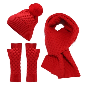 Winter knit set including a red pom-pom beanie, long scarf, and fingerless gloves