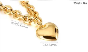 Detail of 450mm chunky chain necklace with a 23mm polished gold heart pendant