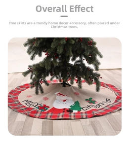 Detail of Christmas tree skirt with red plaid edges, Santa applique, and festive text