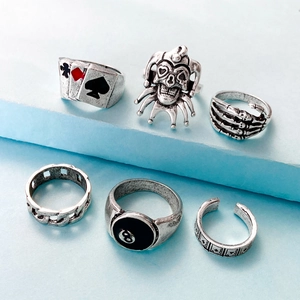 Detail of 6-piece vintage silver gothic ring set featuring skull, joker, and poker designs