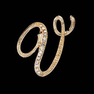 Elegant gold-tone letter V brooch with sparkling rhinestones on black background