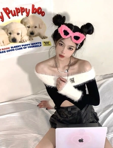 Detail of pink faux fur cat eye sunglasses paired with a monochrome knit plush off-shoulder top