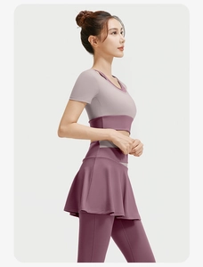 Detail view of double-layer lavender yoga top and burgundy high-waist fitness leggings